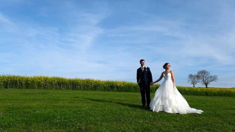 Showing bride and groom with a beautiful skyline in Northumberland
